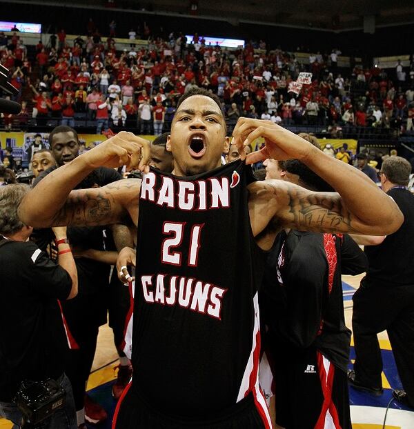 Louisiana Lafayette forward Shawn Long (21) celebrates after defeating Georgia State in an NCAA college basketball game for the Sun Belt Conference tournament championship in New Orleans, Sunday, March 16, 2014. Louisiana Lafayette won 82-81. (AP Photo/Bill Haber) The sight no Panther wanted to see. (Bill Haber/AP)