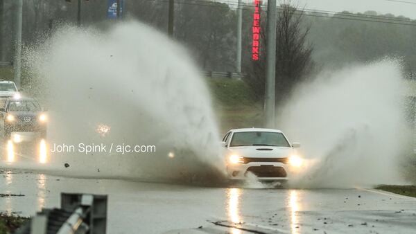 Motorists entering westbound I-20 at Fairburn Road in Douglasville hit pooling water Thursday morning.