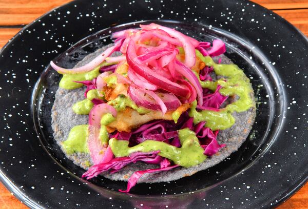 Antiguo Lobo has a variety of tacos, including Pescado: breaded mahi-mahi, avocado salsa, red onion. (Chris Hunt for The Atlanta Journal-Constitution)