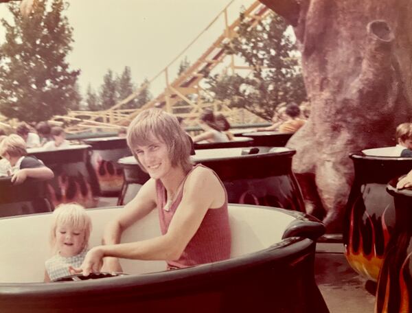 Angela English Hansberger and her dad, Walter English, are seen spinning in a carnival ride. Courtesy of Angela Hansberger