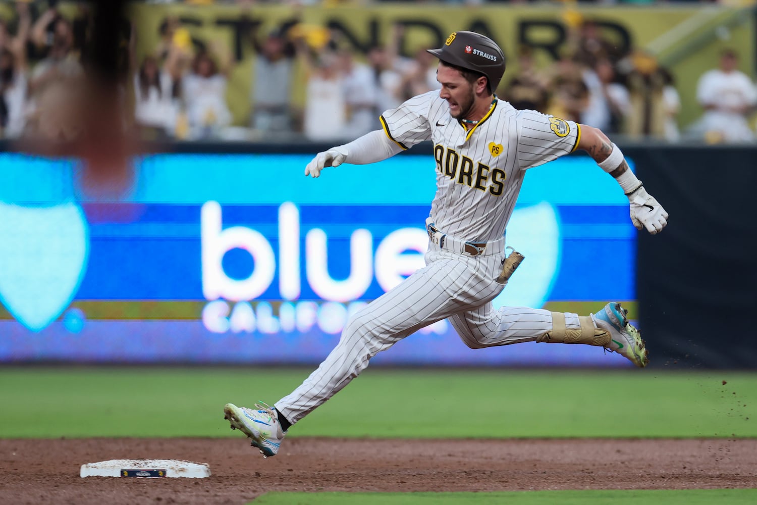 San Diego Padres’ Jackson Merrill (3) rounds second base as he triples against the Atlanta Braves to score two runs during the second inning of National League Division Series Wild Card Game Two at Petco Park in San Diego on Wednesday, Oct. 2, 2024.   (Jason Getz / Jason.Getz@ajc.com)