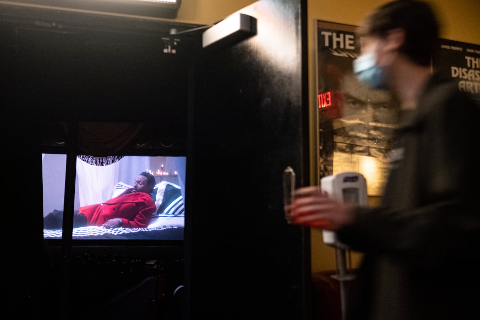 A patron heads to their seat after visiting the bar at the Plaza Theatre. Ben Gray for the Atlanta Journal-Constitution