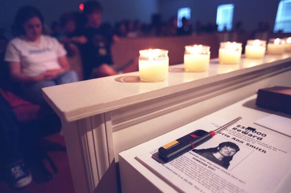 020525 College Park, Ga: On Saturday evening 5/25/02 at Union Christian Church in College Park, friends and relatives of Lorrie Ann Smith attend a candlelight vigil held in her memory. Lorrie Ann was slain in 1997. (ANDY KJELLGREN/STAFF)