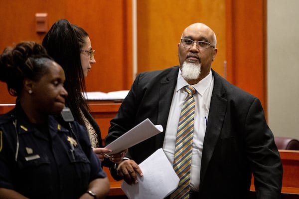 Public Defender Daryl Queen walks back to his chair during the jury selection portion of the trial of Gregory Williams, a mentally ill veteran who is accused of killing his grandmother in 2017, in the DeKalb County Courthouse Monday.   STEVE SCHAEFER / SPECIAL TO THE AJC