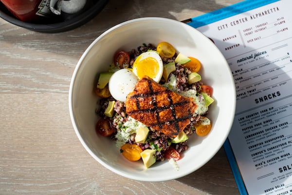 Lite Bowl with whole grains, purple yams, grilled salmon, tzatziki, tomato, 6 minute egg, avocado, and lemon-herb vinaigrette. Photo credit- Mia Yakel.