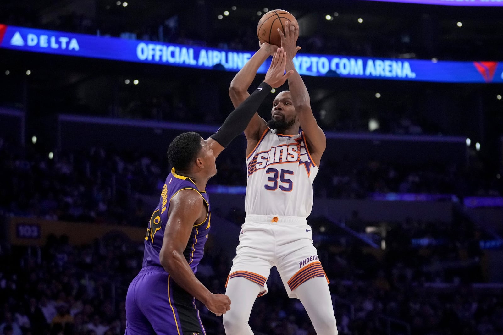 Phoenix Suns forward Kevin Durant (35) shoots over Los Angeles Lakers forward Rui Hachimura (28) during the first half of an NBA basketball game against the in Los Angeles, Friday, Oct. 25, 2024. (AP Photo/Eric Thayer)