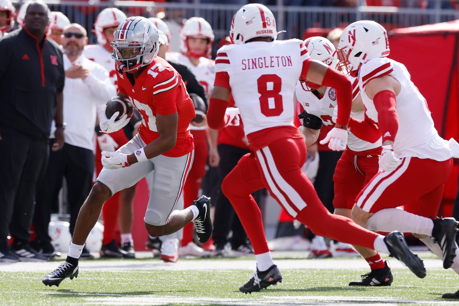 Ohio State receiver Carnell Tate, left, runs after a catch as Nebraska defensive back DeShon Singleton defends during the first half of an NCAA college football game Saturday, Oct. 26, 2024, in Columbus, Ohio. (AP Photo/Jay LaPrete)