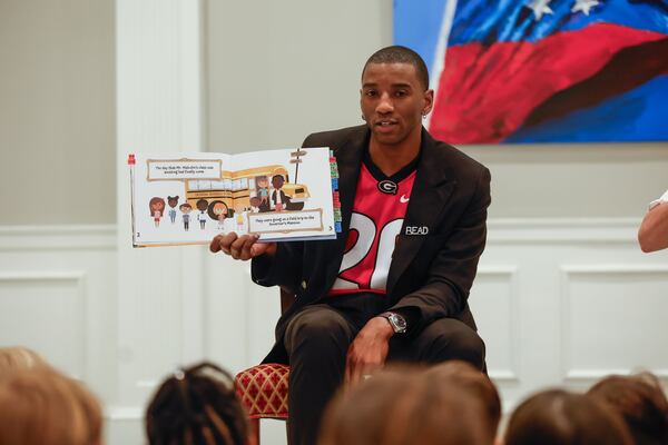 Former UGA football star Malcolm Mitchell reads his new book, “A Magnificent Field Trip to the Governor’s Mansion," to pre-K students from Heards Ferry Elementary at the Governor’s Mansion on May 8, 2024. Natrice Miller/AJC 2024