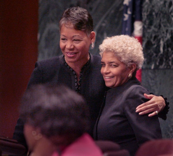 Outgoing council president Lisa Borders gives outgoing Atlanta mayor Shirley Franklin a hug after Franklin said a brief goodbye to the council, Monday, Dec. 7, 2009.