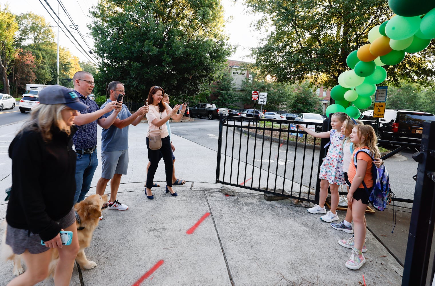 Parents and students arrive for the first day of school at Springdale Park Elementary School in Atlanta on Tuesday, August 1, 2023.   (Bob Andres for the Atlanta Journal Constitution)