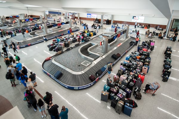 Luggage is lined up at the baggage claim area at Terminal South at Hartsfield-Jackson Atlanta International Airport in Atlanta on Sunday, July 21, 2024.  (Ziyu Julian Zhu / AJC)