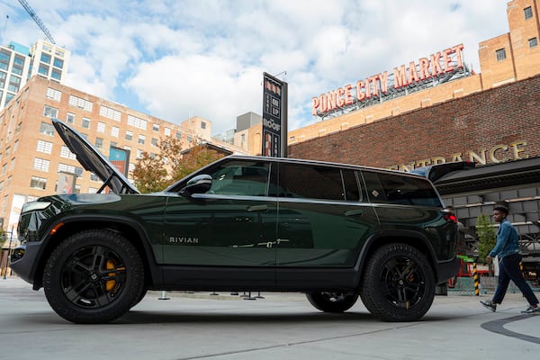 A Rivian R1S is displayed outside of the auto manufacturer's new space at Ponce City Market on Oct. 19, 2023, in Atlanta. (Matthew Pearson/WABE via AP, File)