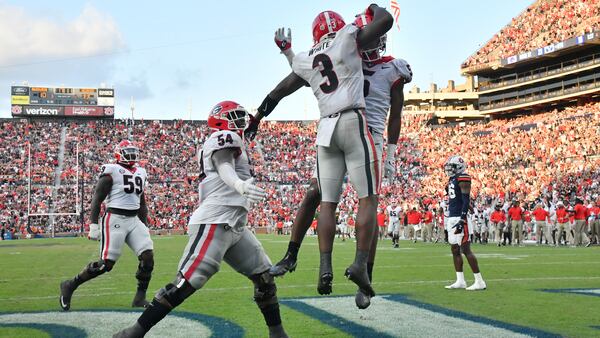 Georgia running back Zamir White (3) celebrates with teammates after scoring a touchdown during the second half against Auburn Saturday, Oct. 9, 2021, in Auburn, Ala. Georgia won 34-10 in 2021, its last trip to Jordan-Hare Stadium. (Hyosub Shin / Hyosub.Shin@ajc.com)