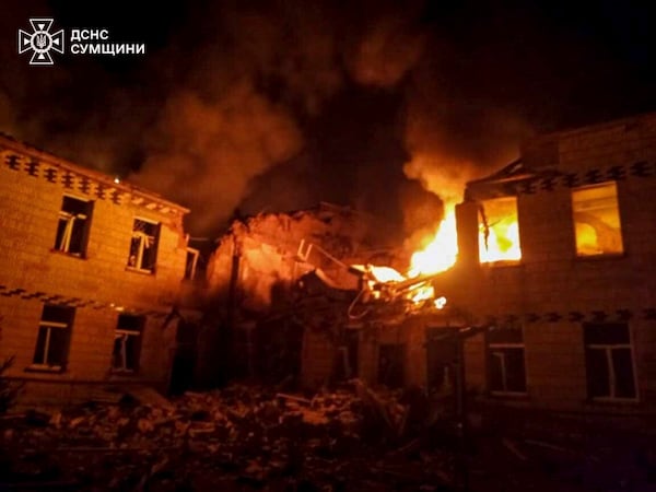 In this photo provided by the Ukrainian Emergency Service on Wednesday, March 19, 2025, flames of fire and smoke engulfed the building after a Russian attack in Krasnopillia, Sumy region, Ukraine. (Ukrainian Emergency Service via AP)