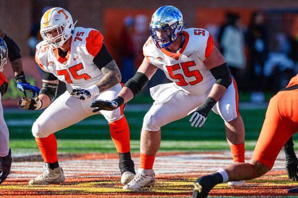 American Team offensive linemen Cade Mays of Tennessee (75) and Luke Fortner of Kentucky (55) respond at the snap during the third quarter of an NCAA Senior Bowl college football game, Saturday, Feb. 5, 2022, in Mobile, Ala. (AP Photo/Butch Dill)