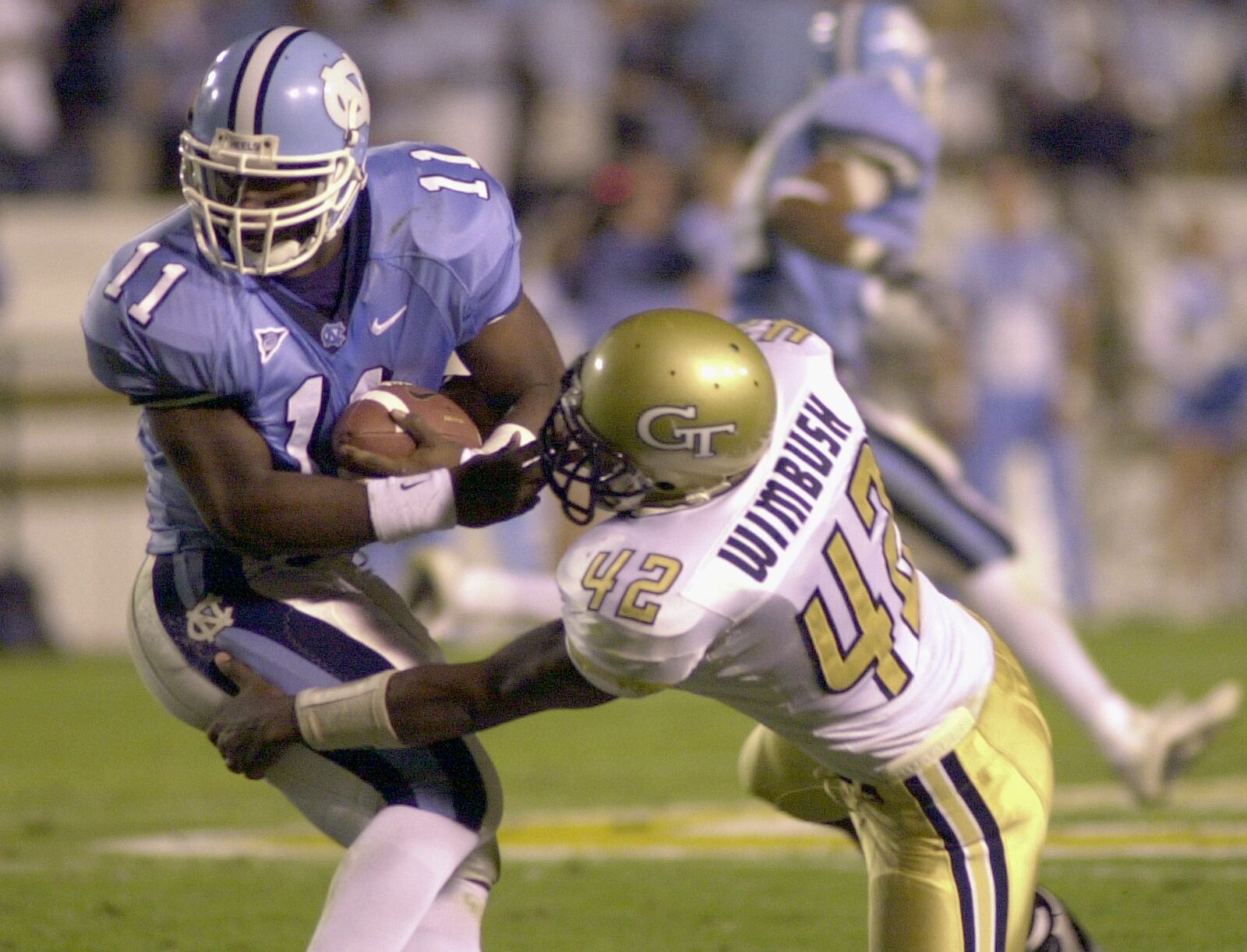 North Carolina quarterback Darian Durant, left, is tackled by Georgia Tech linebacker Recardo Wimbush in the first half on Thursday, Nov. 1, 2001, at Bobby Dodd Stadium in Atlanta. (AP Photo/Erik S. Lesser)