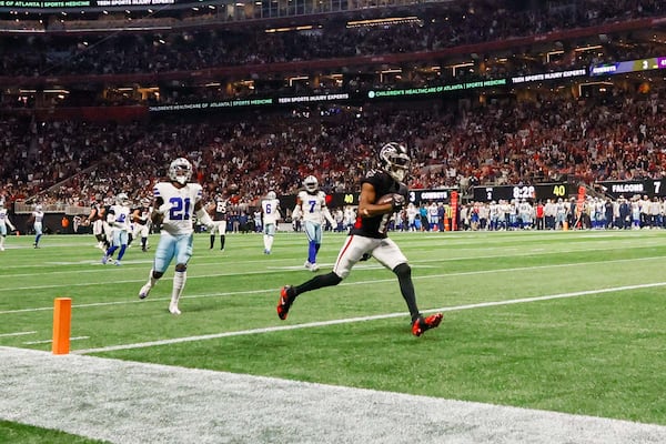 Atlanta Falcons wide receiver Darnell Mooney (1) crosses the end zone for his touchdown during the first half of an NFL football game against the Dallas Cowboys on Sunday, November 3, 2024, at Mercedes-Benz Stadium in Atlanta. 
(Miguel Martinez/ AJC)