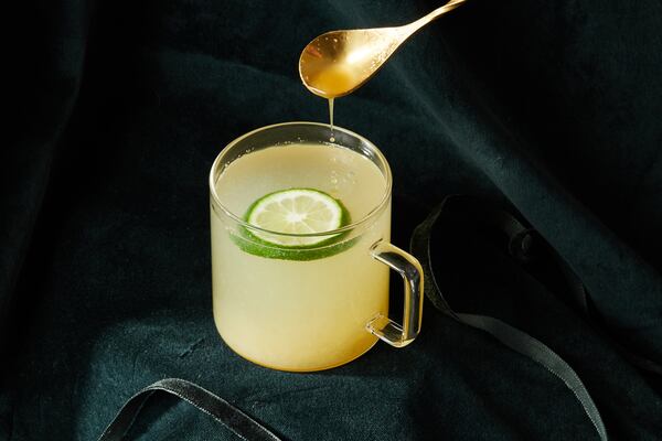 Mezcal Hot Toddy. (Prop styling by Morgan Locke, food styling by Kate Williams / Bailey Garrot for The Atlanta Journal-Constitution.)