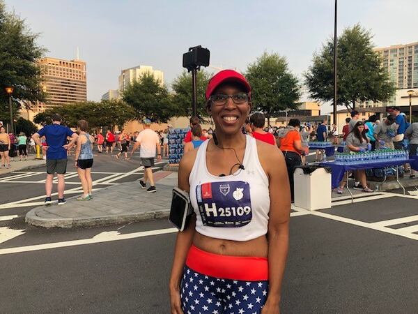 Kim Dorsey of Smyrna before the AJC Peachtree Road Race on July 3, 2021. Dorsey was to run her sixth Peachtree. "I just love being around people,"  she said. (AJC photo by Ken Sugiura)