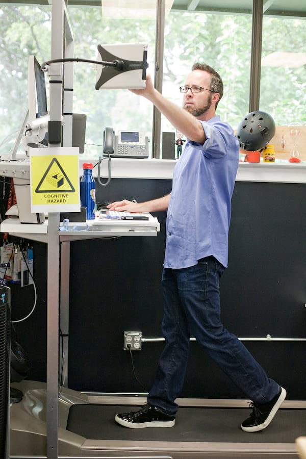 Thao Nguyen/FOR AMERICAN-STATESMAN 08/23/12

William "Whurley" Hurley walks on a treadmill workstation dubbed Treaduolous was developed by Chaotic Moon to allow a person to walk while working in their normal work attire in Austin, Texas on August 23, 2012. Hurley has been doing about 20-30 miles a week on the device.