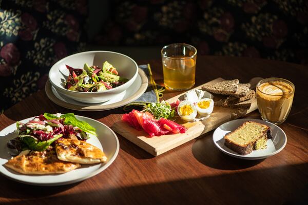 Le Bon Nosh Pear Galette, Beet Cured Salmon, Beet Salad, pistachio cake, latte, and tea. (Mia Yakel for The Atlanta Journal-Constitution)