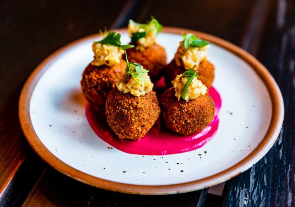 Bitterballen with smoked brisket, apple mostarda and beet sabayon. CONTRIBUTED BY HENRI HOLLIS