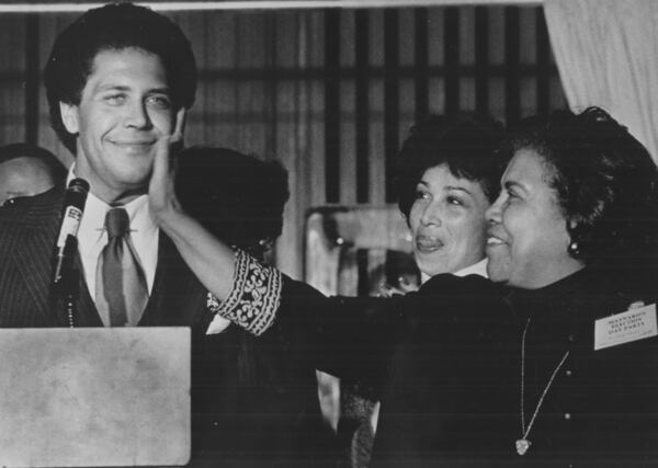 Maynard Jackson, Atlanta's first Black mayor, receives a love pat on the face from his mother. (AJC FILE) 