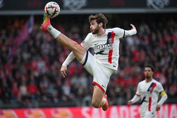 PSG's Khvicha Kvaratskhelia takes the ball during the French League One soccer match between Rennes and Paris Saint-Germain at Roazhon Park stadium in Rennes, France, Saturday March 8, 2025. (AP Photo/Matthieu Mirville)