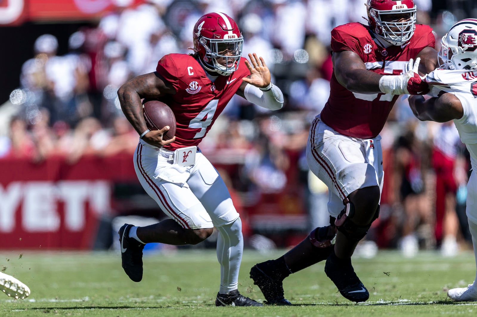 Alabama quarterback Jalen Milroe (4) runs the ball against South Carolina during the first half of an NCAA college football game, Saturday, Oct. 12, 2024, in Tuscaloosa, Ala. (AP Photo/Vasha Hunt)