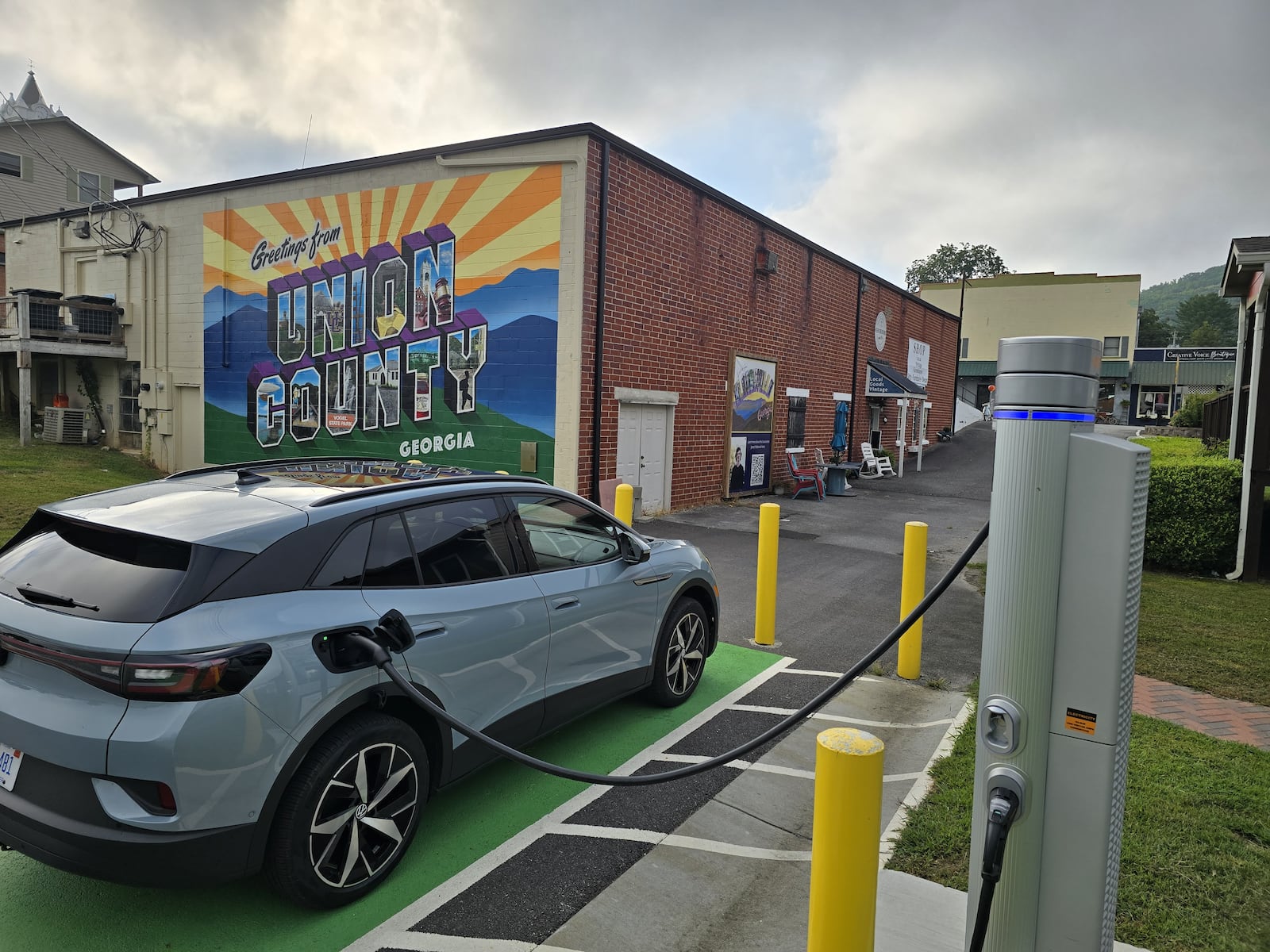 A Volkswagen ID.4 electric car uses a public charging station in a municipal parking lot in Blairsville, Ga. Volkswagen Group is using metro Atlanta as the starting line for a new subscription service that’s intended to offer an alternative to car leasing and vehicle ownership. (Courtesy of Chris Hardesty 2024)