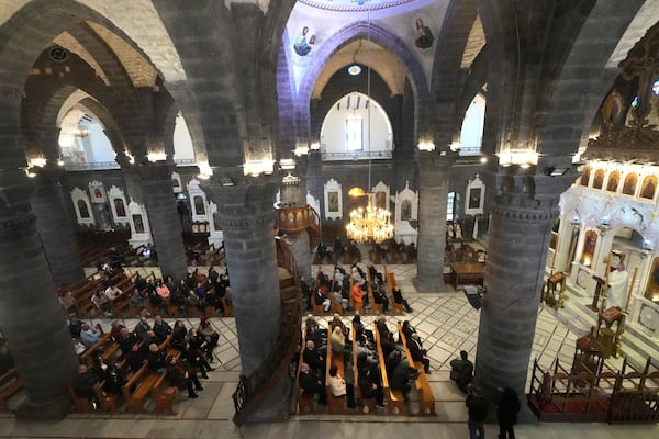 Syrian attend the first Sunday Mass since Syrian President Bashar Assad's ouster, at Mariamiya Orthodox Church in old Damascus, Syria, Sunday, Dec. 15, 2024. (AP Photo/Hussein Malla)