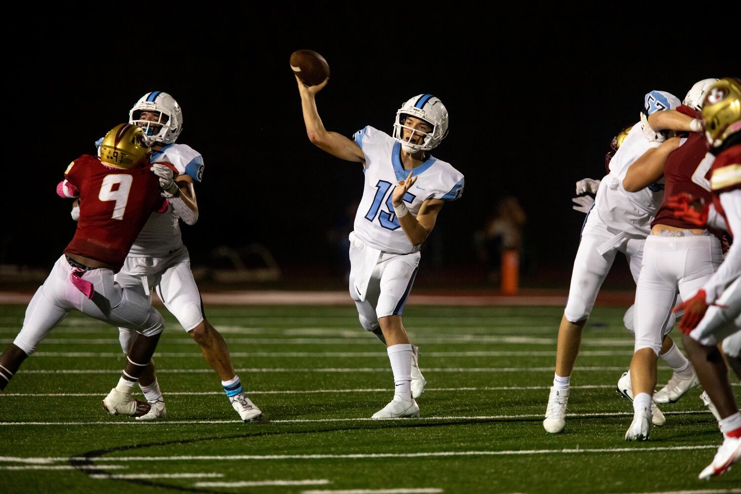 Cambridge quarterback Zach Harris (15) throws the ball during a GHSA high school football game between Cambridge High School and Johns Creek High School in Johns Creek, Ga. on Friday, October 15, 2021. (Photo/Jenn Finch)