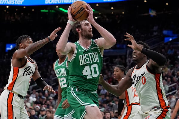 Boston Celtics center Luke Kornet (40) drives to the basket against the Detroit Pistons during the first half of an NBA basketball game, Wednesday, Dec. 4, 2024, in Boston. (AP Photo/Charles Krupa)