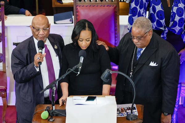 At the end of the worship service, Bishop Reginald T. Jackson (left) and Pastor John Foster say a prayer for Fulton County District Attorney Fani Willis at the Big Bethel AME church on Sunday, January 14, 2024.
Miguel Martinez /miguel.martinezjimenez@ajc.com