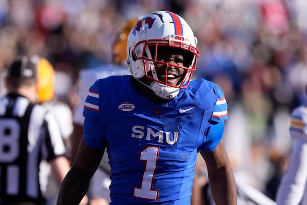 SMU running back Brashard Smith (1) smiles after scoring a touchdown during the first half of an NCAA college football game against California, Saturday, Nov. 30, 2024, in Dallas. (AP Photo/LM Otero)