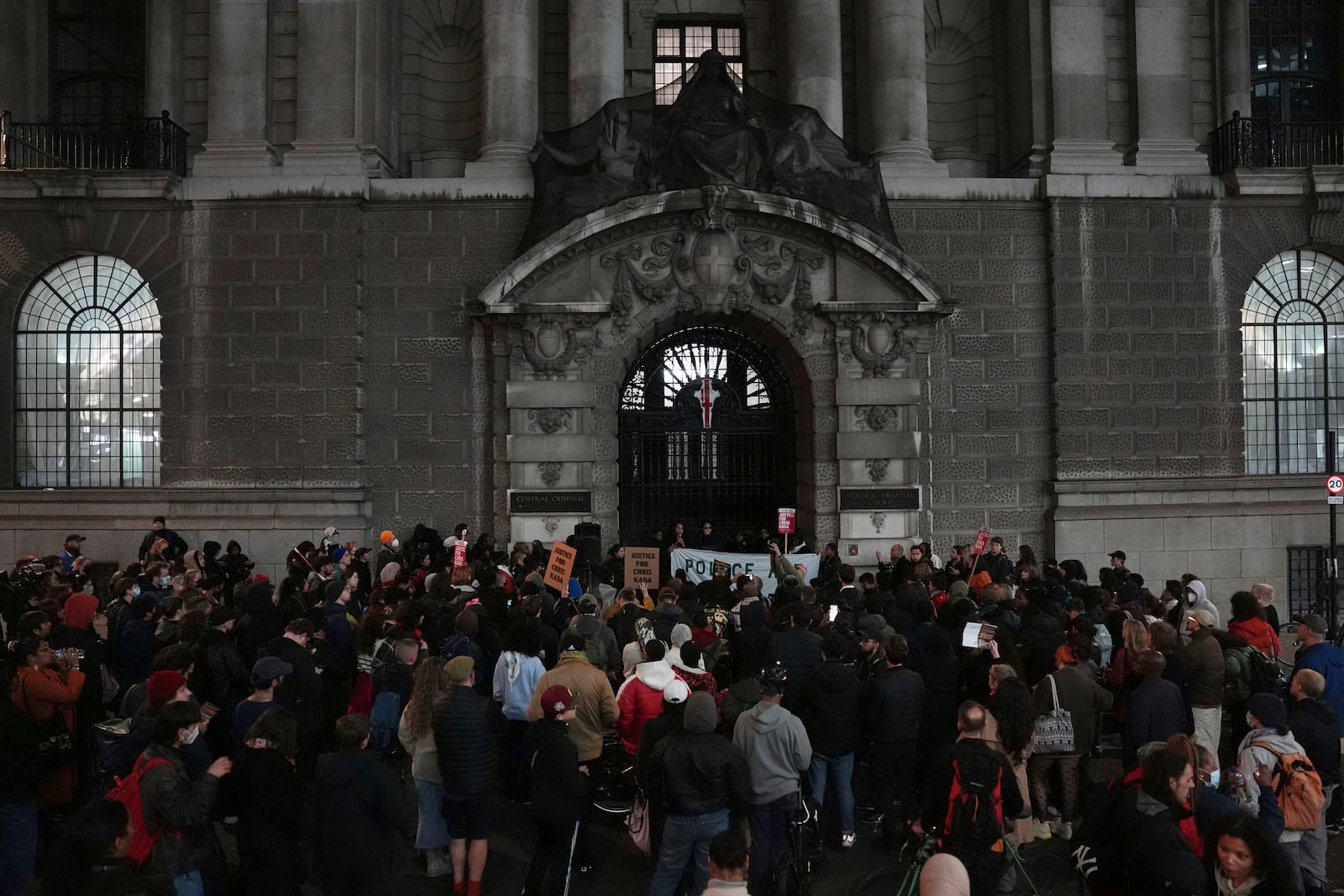 People demonstrate outside the Old Bailey in central London, Monday Oct. 21, 2024, after the London police officer who fatally shot Chris Kaba was acquitted of murder. (Jordan Pettitt/PA via AP)