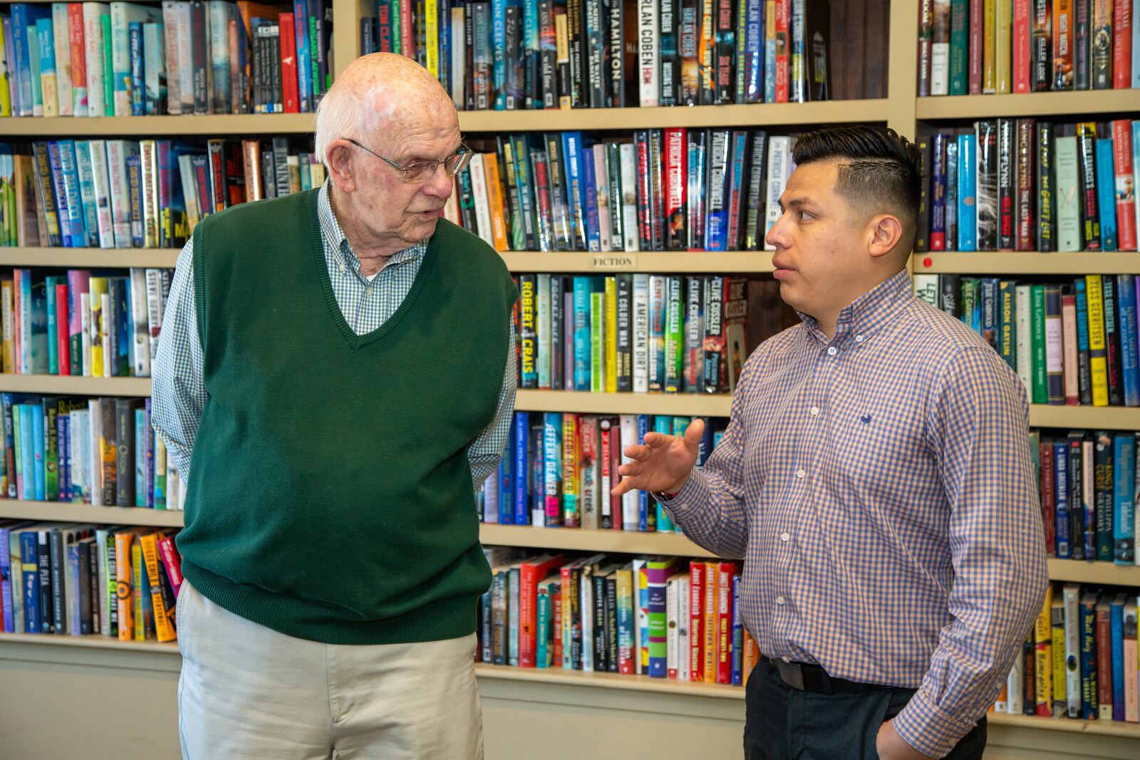 Don Sapit (left) talks with Jose Pliego in the Park Springs library. PHIL SKINNER FOR THE ATLANTA JOURNAL-CONSTITUTION.