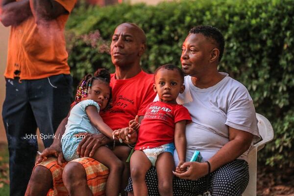 Albert and Sharon Williams and their children,  3-year-old Ariyonna, left, and 2-year-old Auden, were evacuated from their DeKalb County home Monday morning after a fire. JOHN SPINK / JSPINK@AJC.COM