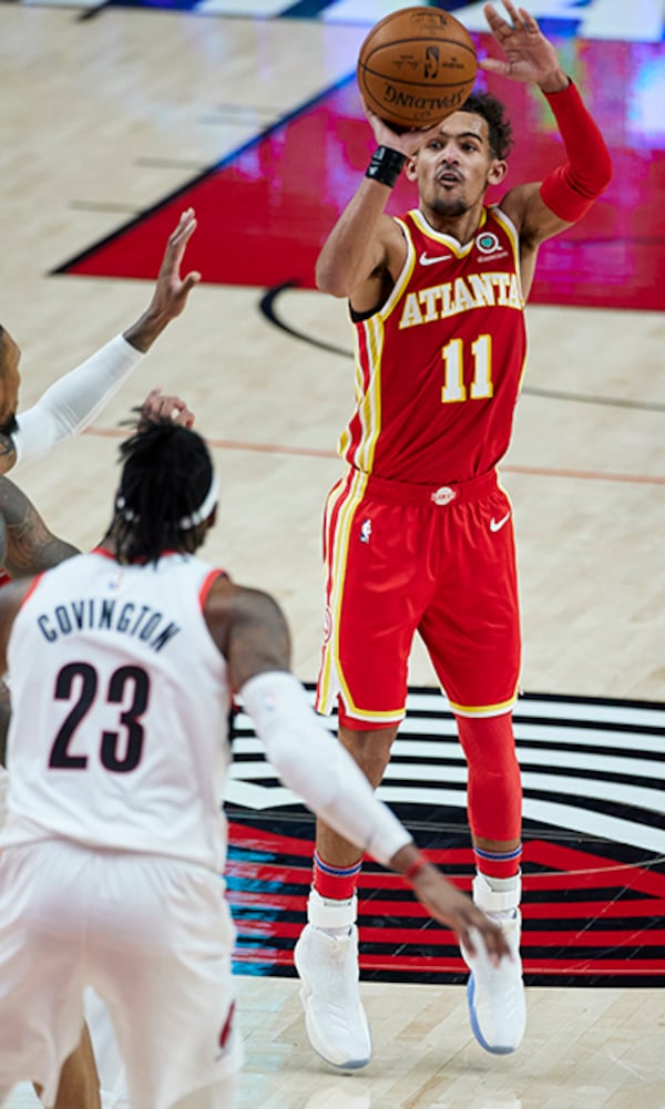 Atlanta Hawks guard Trae Young shoots a 3-pointer against the Portland Trail Blazers during the second half Saturday, Jan. 16, 2021, in Portland, Ore. (Craig Mitchelldyer/AP)