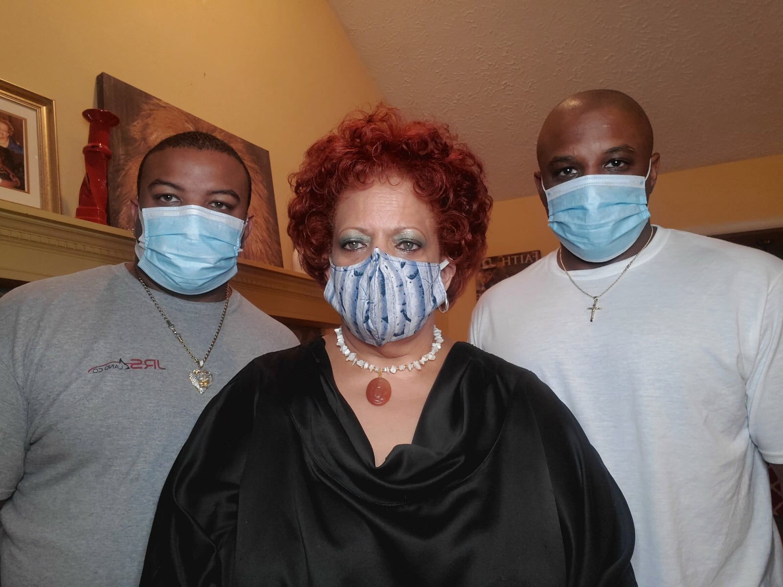 COVID-19 survivor Teresa Sardine of Fayetteville, center, with her sons, Jason, left, and Gary. Sardine does not have the same level of energy she possessed before she tested positive for the disease. Family photo