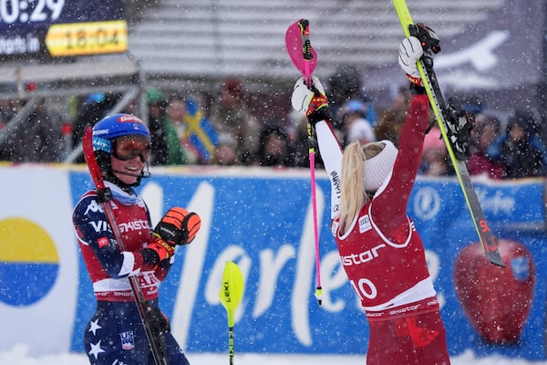 United States' Mikaela Shiffrin applauds the winner Austria's Katharina Truppe after an alpine ski, women's World Cup slalom in Are, Sweden, Sunday, March 9, 2025. (AP Photo/Giovanni Auletta)