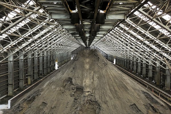 Copper ore piles up at the Cobre Panama copper mine, owned by Canada's First Quantum Minerals, during a media tour of the mine that was closed after Panama's Supreme Court ruled that the government concession was unconstitutional, in Donoso, Panama, Friday, March 21, 2025. (AP Photo/Matias Delacroix)