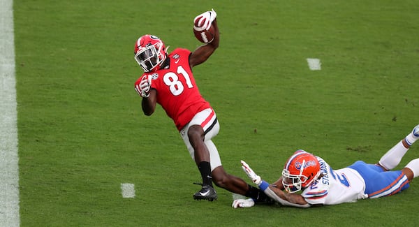 Bulldogs wide receiver Marcus Rosemy-Jacksaint was injured on this touchdown reception against the Gators in November 2020 in Jacksonville, Fla. (Curtis Compton / Curtis.Compton@ajc.com)  