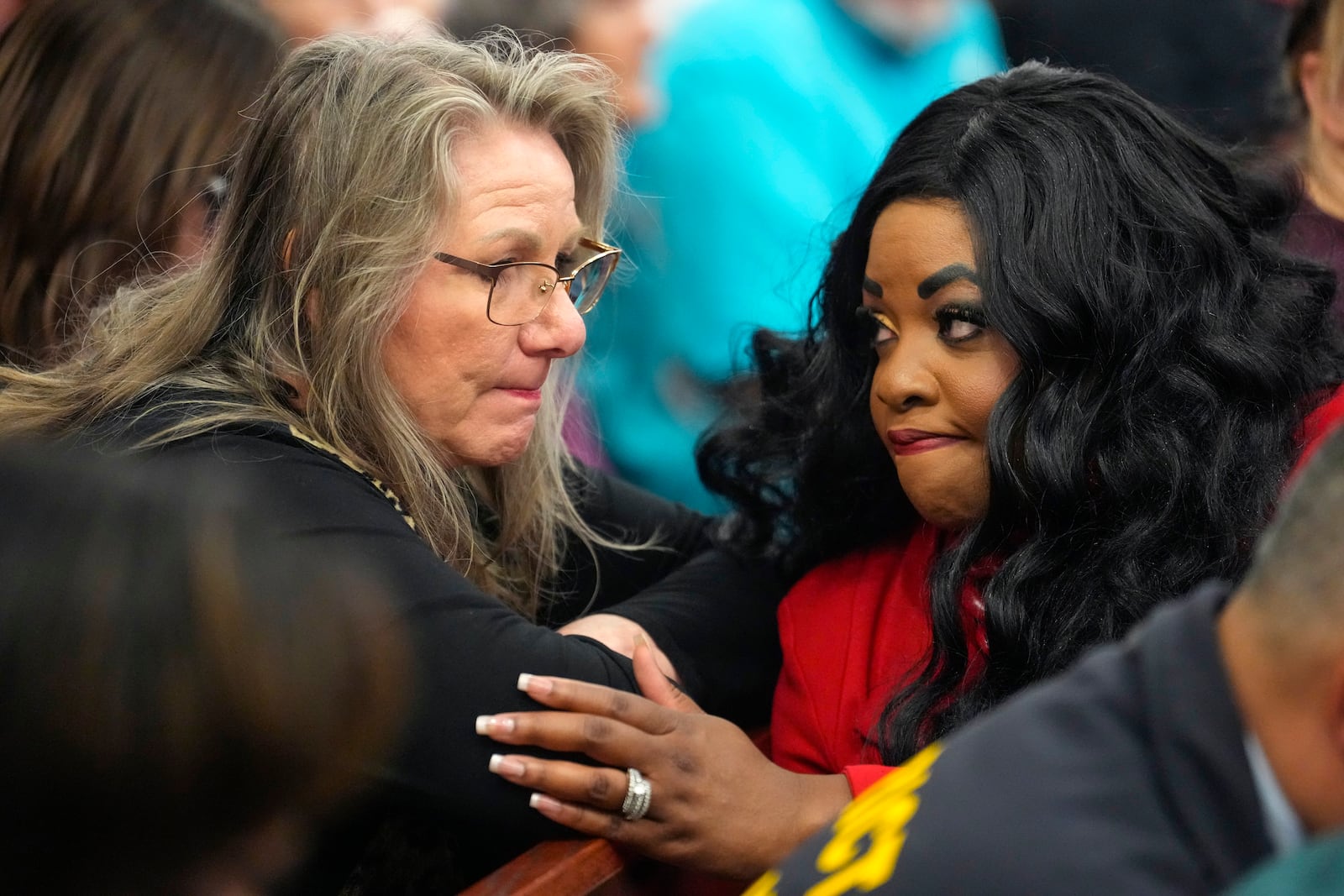 Elizabeth Ferrari, sister of Dennis Tuttle, left, talks to prosecutor Tanisha Manning, after former Houston police officer Gerald Goines was sentenced to 60 years behind bars on a pair of felony murder convictions on Tuesday, Oct. 8, 2024, in Houston. Goines was found guilty of felony murder in the 2019 deaths of Dennis Tuttle and Rhogena Nicholas. (Brett Coomer/Houston Chronicle via AP)