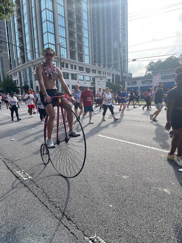 Riding special bikes in honor of a late friend at The Atlanta Journal-Constitution Peachtree Road Race on Thursday, July 4, 2024. (Photo: Anisah Muhammad/AJC)