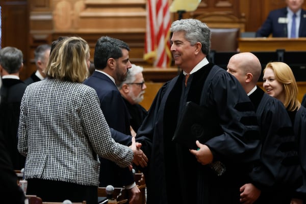 Georgia Supreme Court Chief Justice Michael Boggs greets Speaker Pro Tem Jan Jones after the annual State of the Judiciary address to lawmakers in January.