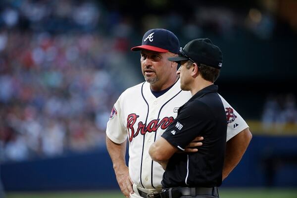 Atlanta Braves manager Fredi Gonzalez, left, talks to an official in the fifth inning of a baseball game against the Miami Marlins, Sunday, Aug. 31, 2014, in Atlanta. (AP Photo/David Goldman) "I think we're better than Milwaukee. What about you?" (David Goldman/AP)