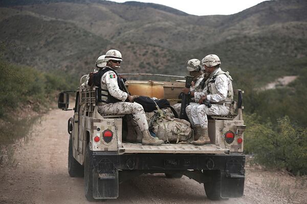 Mexican national guardsmen patrol near Bavispe, at the Sonora-Chihuahua border, Mexico, on Wednesday. When drug cartel gunmen opened fire on American women and children in northern Mexico on Monday, the Mexican Army, the National Guard and Sonora state police were not there to protect them. It took them about eight hours to arrive.