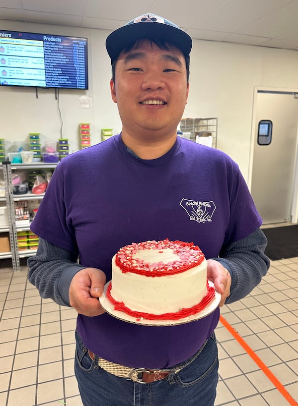 Yu Qian Yip presents a celebration cake made at Special Kneads and Treats in Lawrenceville. (Courtesy of Special Kneads and Treats)