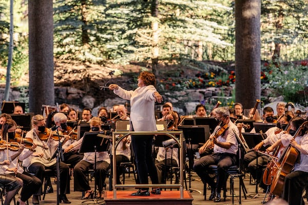 -- PHOTO MOVED IN ADVANCE AND NOT FOR USE - ONLINE OR IN PRINT - BEFORE SUNDAY, AUG. 7, 2022 -- The conductor Nathalie Stutzmann leads the Philadelphia Orchestra at the Bravo! Vail music festival in Vail, Colo., July 16, 2022.  With a minivan and a three small children in tow, the New York Times critic David Allen spent nearly two weeks discovering classical music offerings in the Rocky Mountains. (Andrew Miller/The New York Times)